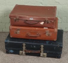Three vintage suitcases to include Dreadnought and Revelation examples.