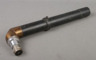 A vintage metal periscope. The lens marked for Ernst Leitz Wetzlar.