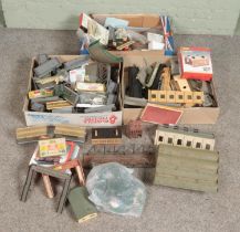 Three boxes of railway diorama accessories including a large quantity of buildings, platform pieces,