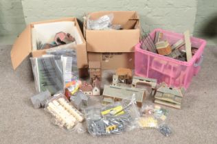 Three large boxes of railway diorama accessories including a large quantity of buildings, miniatures