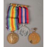 A set of World War medals, containing WWI Victory Medal and 1939-45 War medal. Both attached on