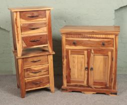 A collection of exotic hardwood furniture to include side board and two small bedside drawers.
