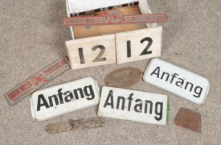 A collection of wood and metal signs. Includes railway markers, Anfang, Hurst Nelson & Co, Hansons