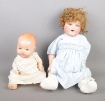 Two Armand Marseille bisque headed porcelain dolls each marked to nape of neck. Larger example