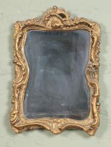 A gilt plaster Florentine Rococo style wall mirror. 52x38cm