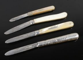 A collection of four silver bladed folding fruit knives including mother of pearl handled examples