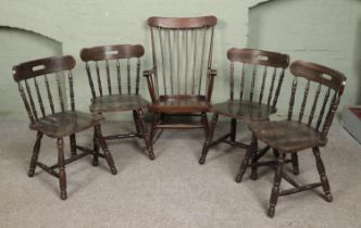 A set of four tavern chairs along with a spindle back rocking chair.