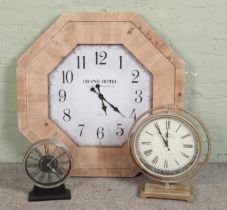 A collection of modern clocks including an extra large wall clock with thick wooden frame.