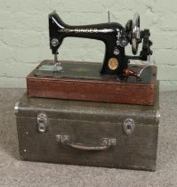 A vintage Singer Sewing machine in faux crocodile skin case