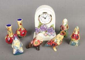 A collection of Old Tupton Ware ceramics to include clock, miniature vases, owls and spectacle
