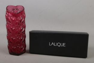 A Lalique rouge heart motif glass vase "Vase Armour Rouge", with original box. Hx16cm Good