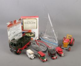 A collection of model vehicles. Includes Wintrade sail boat, Wade Eddie Stobart truck, Zetor