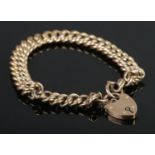 A 9ct Gold rope twist bracelet chain with heart shaped locket clasp. The locked monogrammed for KAH.
