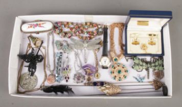 A tray of vintage costume jewellery, to include dragonfly pendants, Mortima necklace watch, four hat