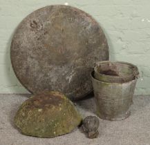 A mixed quantity of garden items including marble table top, hand carved saddle stone top, metal