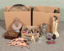 Two boxes of miscellaneous to include glass paperweights, diecast vehicles, composite figures,