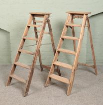 Two pairs of vintage five-rung wooden stepladders. To include Simplex example.