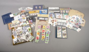 A collection of stamps, cards and similar items. To include a large quantity of unfranked stamps,