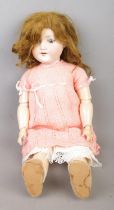 An Armand Marseille bisque head socket doll stamped 390n. A.6Â½.M. to nape of neck.