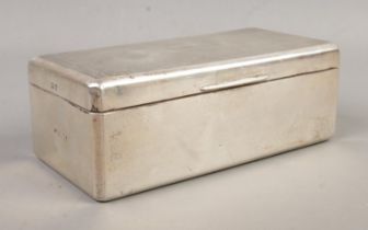 A large hinged silver mounted cigarette box. Assayed Birmingham, 1939 by William Neale. Total