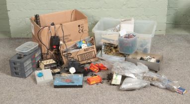 Two boxes of assorted model railway spares and repairs to include wiring and controllers, railway