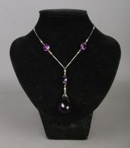 An art deco Platinon necklace, set with small simulated pearls and amethyst coloured stones.