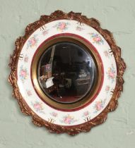 A Burleigh Ware Burgess & Leigh convex wall mirror, with gilt and floral detailing. 49cm diameter.