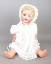 An Armand Marseille bisque head porcelain doll stamped 1330. A.7.M to neck along with a similar