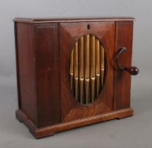 A late 18th/early 19th century mahogany barrel organ. Height 30.5cm. Bellows and cylinder appear