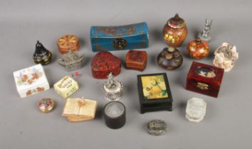 A collection of assorted novelty trinket boxes to include papier mache, hardstone and ceramic