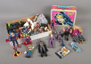 A collection of child's action figures to include Batman, Star Wars, Superman, Marvel, Scooby Doo,