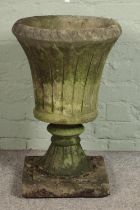 A reconstituted stone garden urn. Hx66cm