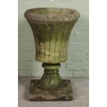 A reconstituted stone garden urn. Hx66cm