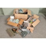 Three large boxes of railway diorama accessories including track, buildings, soil and substrate,