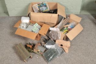 Three large boxes of railway diorama accessories including track, buildings, soil and substrate,