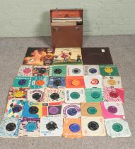 A box and carry case of assorted singles and LP records, mainly 60's and 70's examples. To include