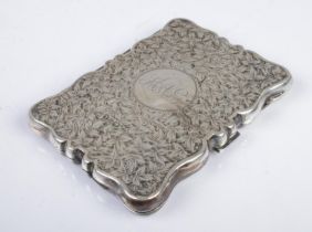 An early Twentieth Century silver hinged card case, heavily engraved with leaf detailing and central