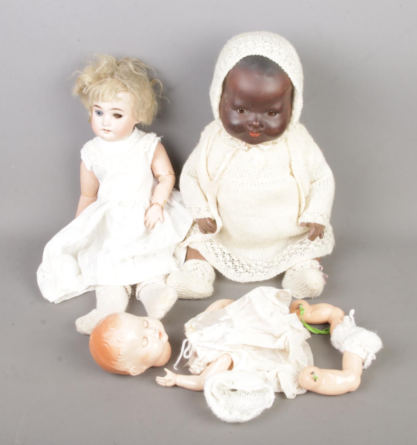 Two Armand Marseille bisque head porcelain dolls stamped A.M Â½ DEP and 351./4.K along with