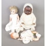 Two Armand Marseille bisque head porcelain dolls stamped A.M Â½ DEP and 351./4.K along with