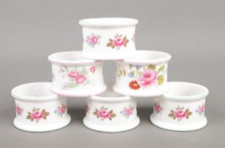 Six Shelley ceramic footed napkin holders. To include Rosebud and Rose and Red Daisy design