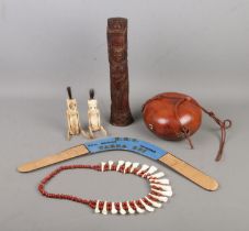 A collection of Aboriginal and tribal art to include carved bone jointed figures, multi-signed