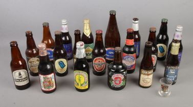 A collection of beer and advertising bottles including Blue Label, Silver Jubilee and Guild Ale,