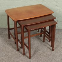 A mid 20th century nest of three tables by Remploy.