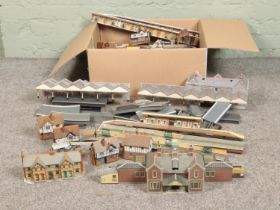 Two boxes of railway diorama accessories including a large quantity of buildings with large platform