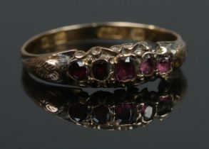 A Victorian 15ct Gold ring, set with five amethyst coloured stones. Size PÂ½. Assayed Birmingham,