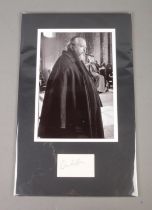 An Orson Welles (1915-1985) autograph mounted alongside monochrome film still.