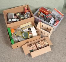 Three large boxes of railway diorama accessories mostly comprising of buildings with some diorama