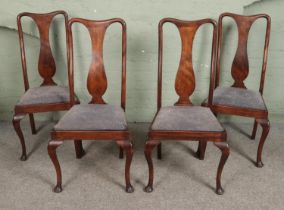 A set of four mahogany Queen Anne style dining chairs, with vase splat back and fabric upholstered