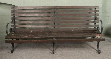 A vintage wrought iron 6ft garden bench with triple base