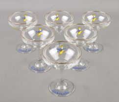 A set of six Babycham glasses.